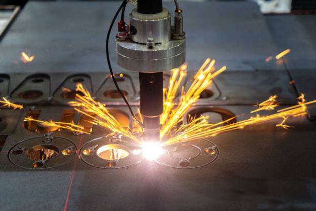 A person is using laser technology for custom metal fabrication.